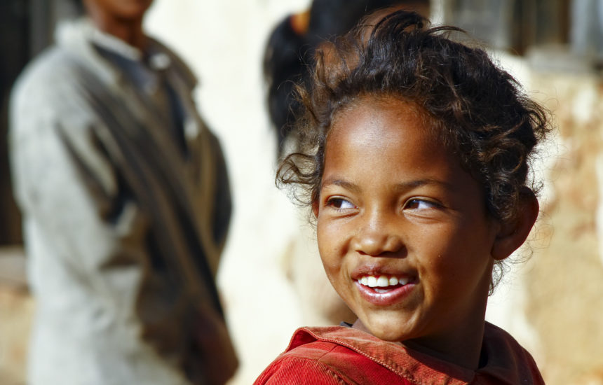 A close-up of a young girl smiling.