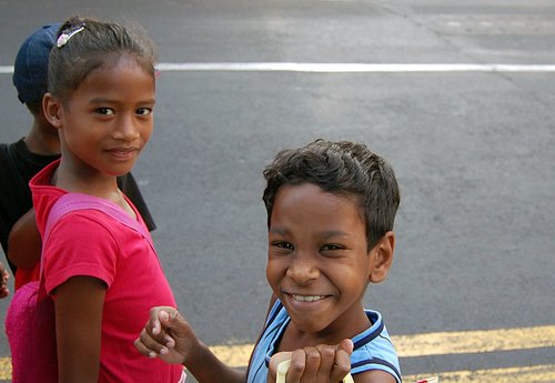 2 children looking at the camera, smiling