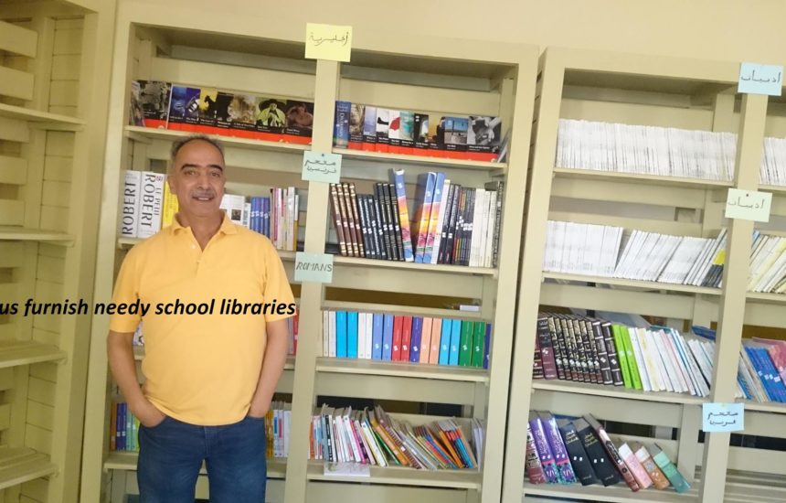 A man standing in front of bookcases