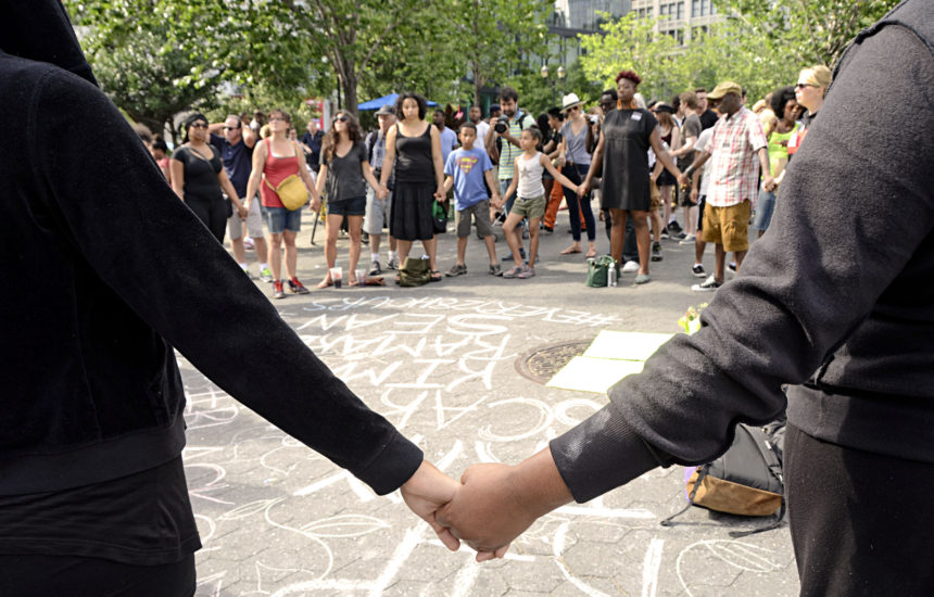 People holding hands in a circle