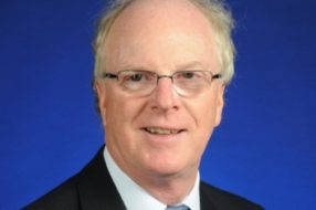 Headshot of Eric Deakins