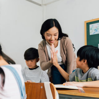 Teacher ensuring holistic learning occurs by caring for students' wellbeing.