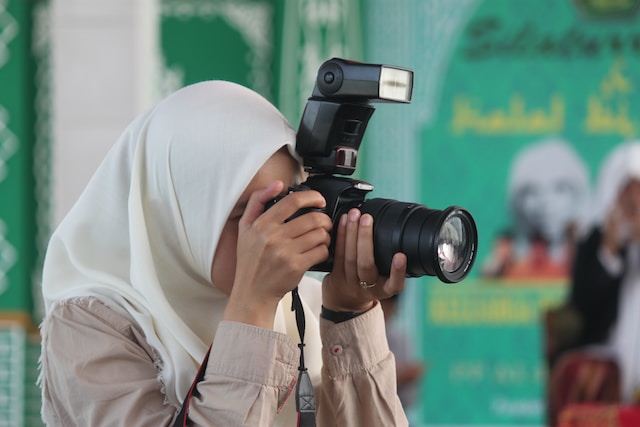 Girl taking a photo with camera