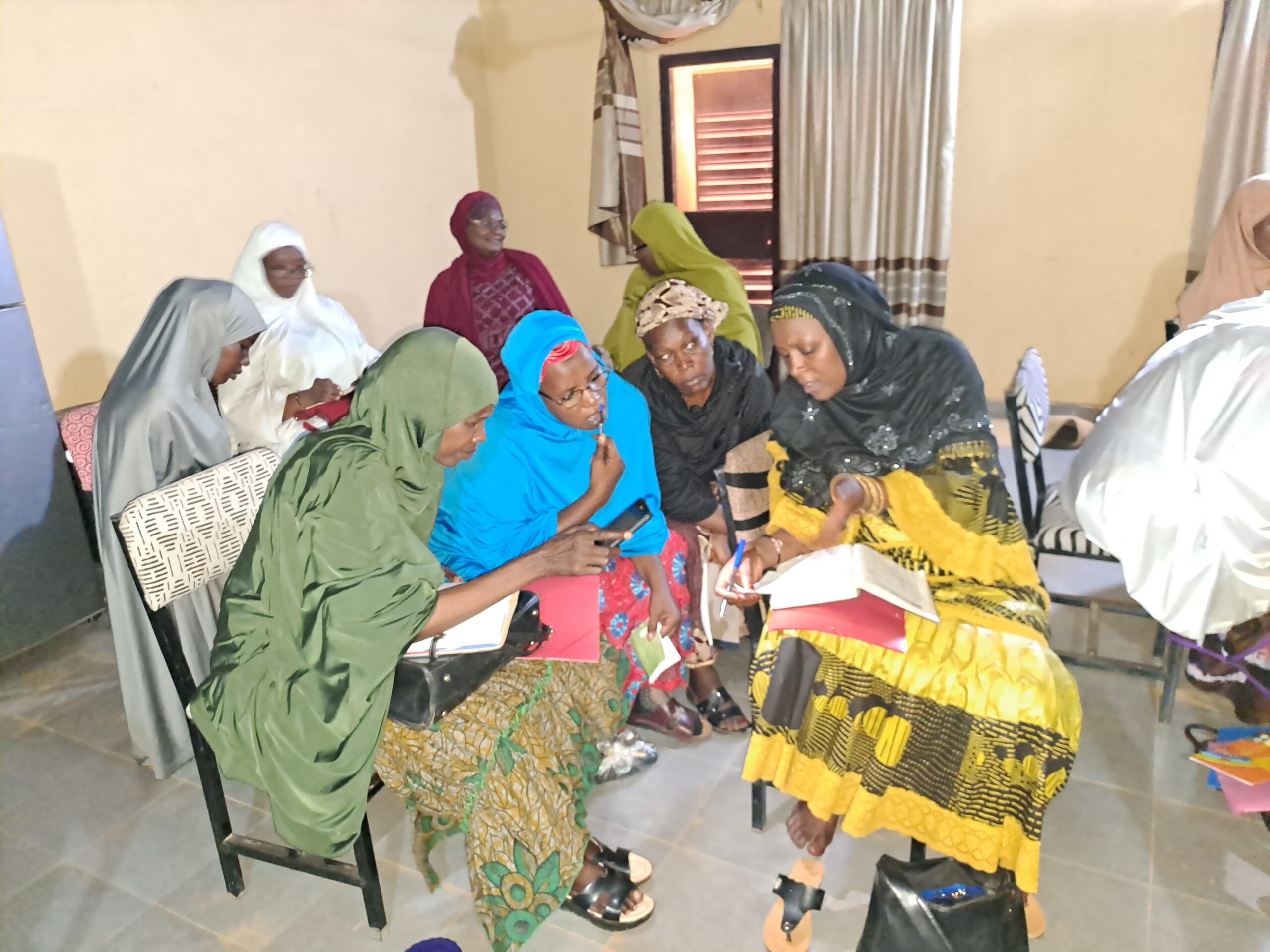 Photo of four QHL teacher fellows working together on materials