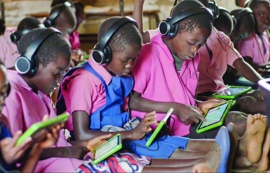 Children in an African school working on tablets