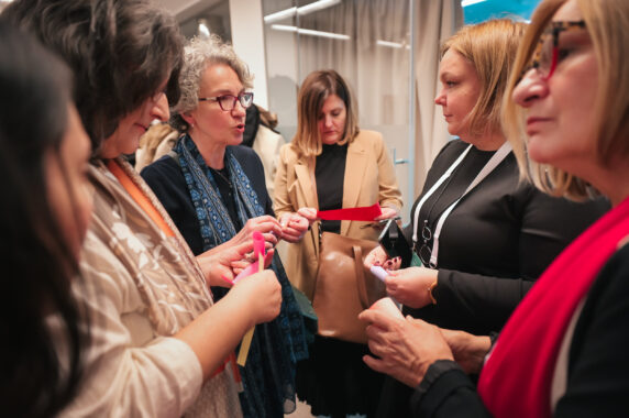 Conference attendees speaking with each other.